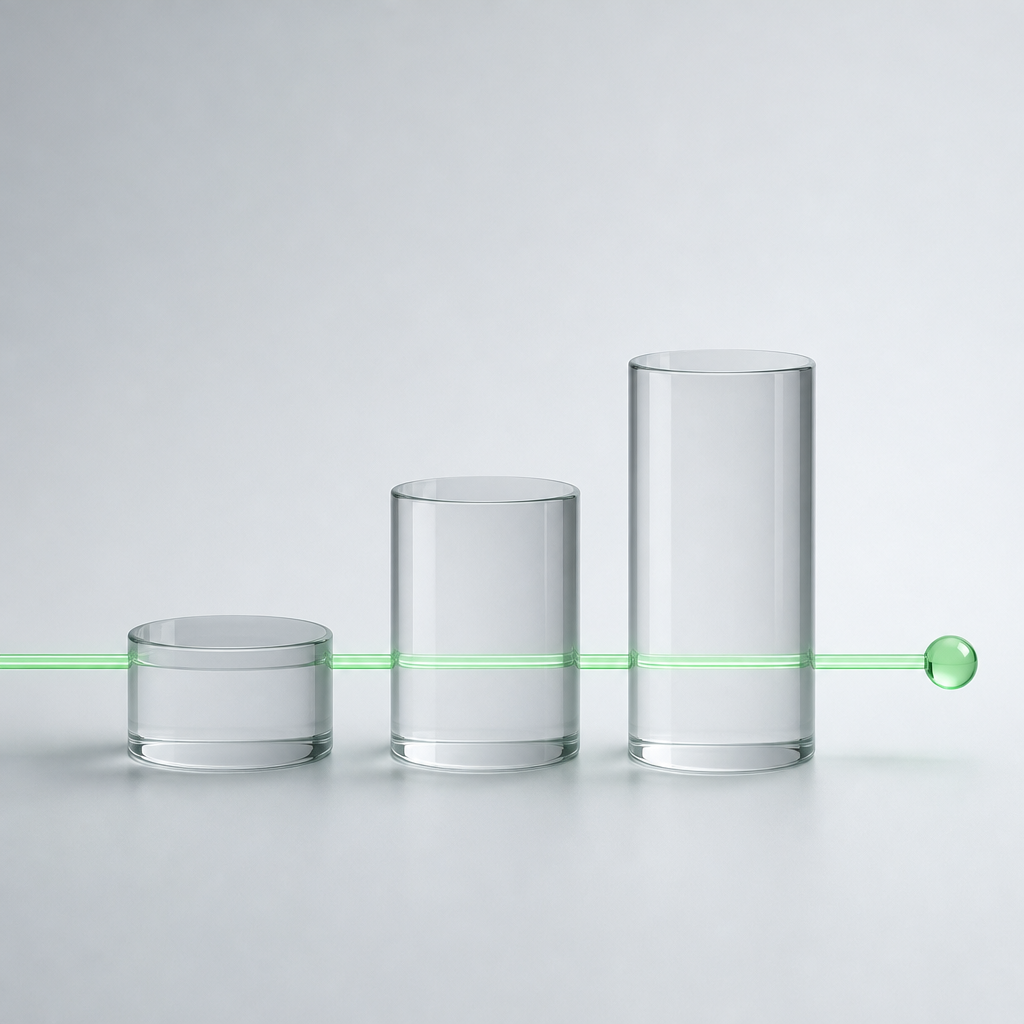 Three clear glass cylinders of rising height in a row, with one thin green glass line passing through all three and ending in a small green sphere.